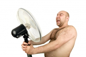man with cooling fan , closeup, isolated background